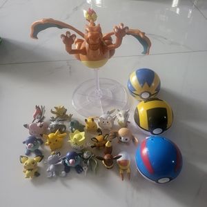 Mini Pokémon figures with poke balls included also sharzar  dragon with stand
